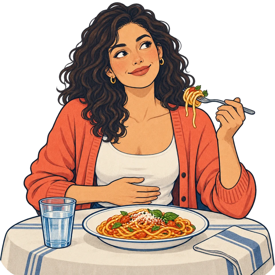 Una donna ha fame davanti a un piatto di pasta.